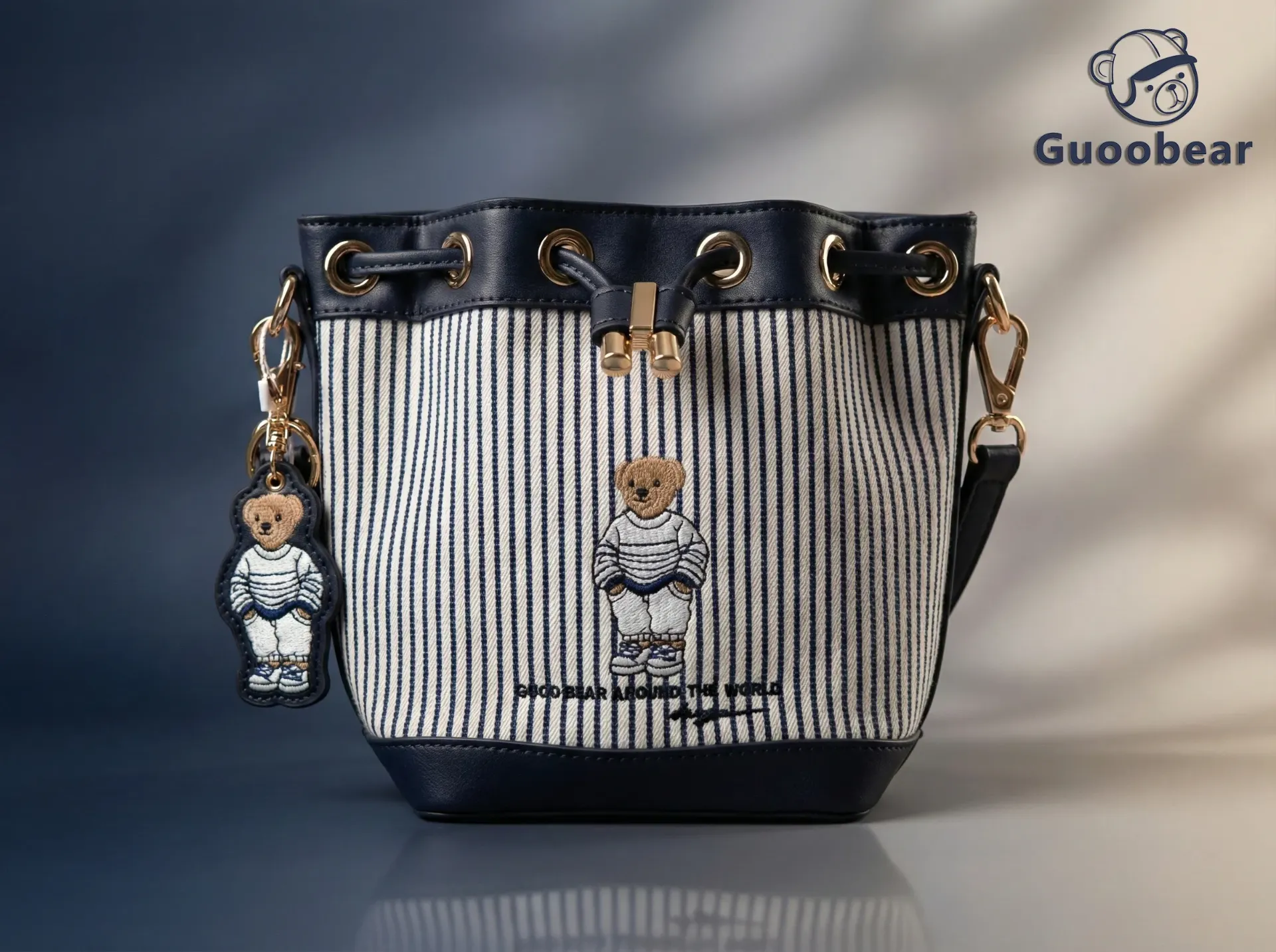 Blue and white striped canvas embroidered bucket bag